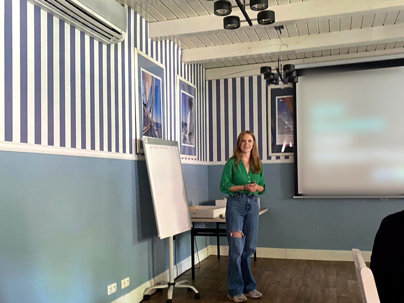 Julia opening a session next to the flipchart